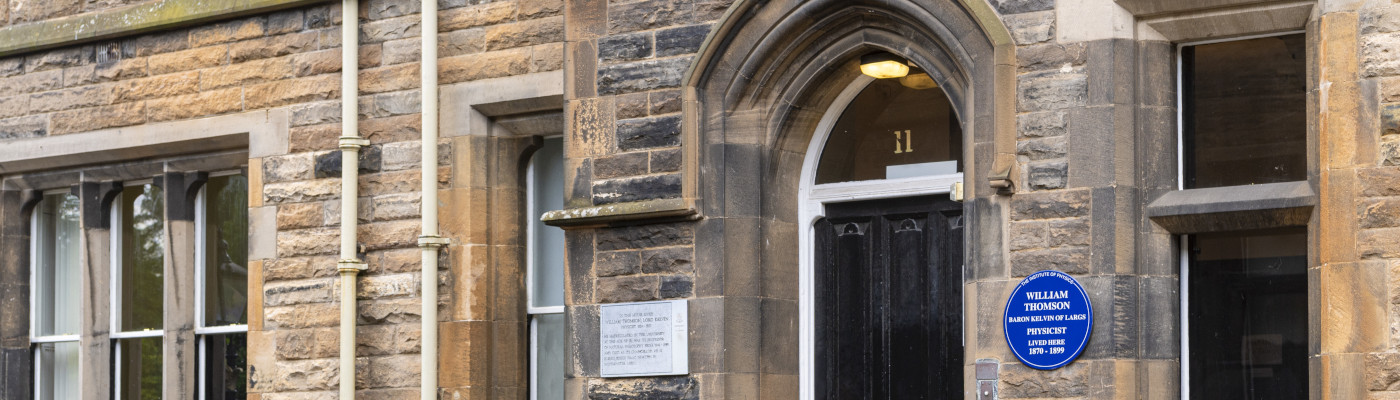 Banner aspect shot of the front door of 11 The Square, showing the Lord Kelvin blue plaque