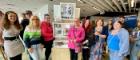 An image of Susan Grant with the Chance2Change group in front of the tower exhibit