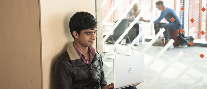 a student reading on a couch in the Library