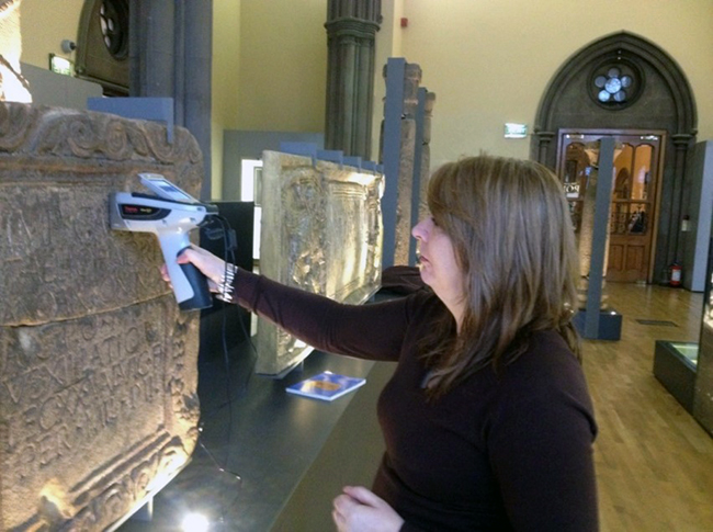 Dr Louisa Campbell, using a p-XRF machine on The Hunterian Roman stones