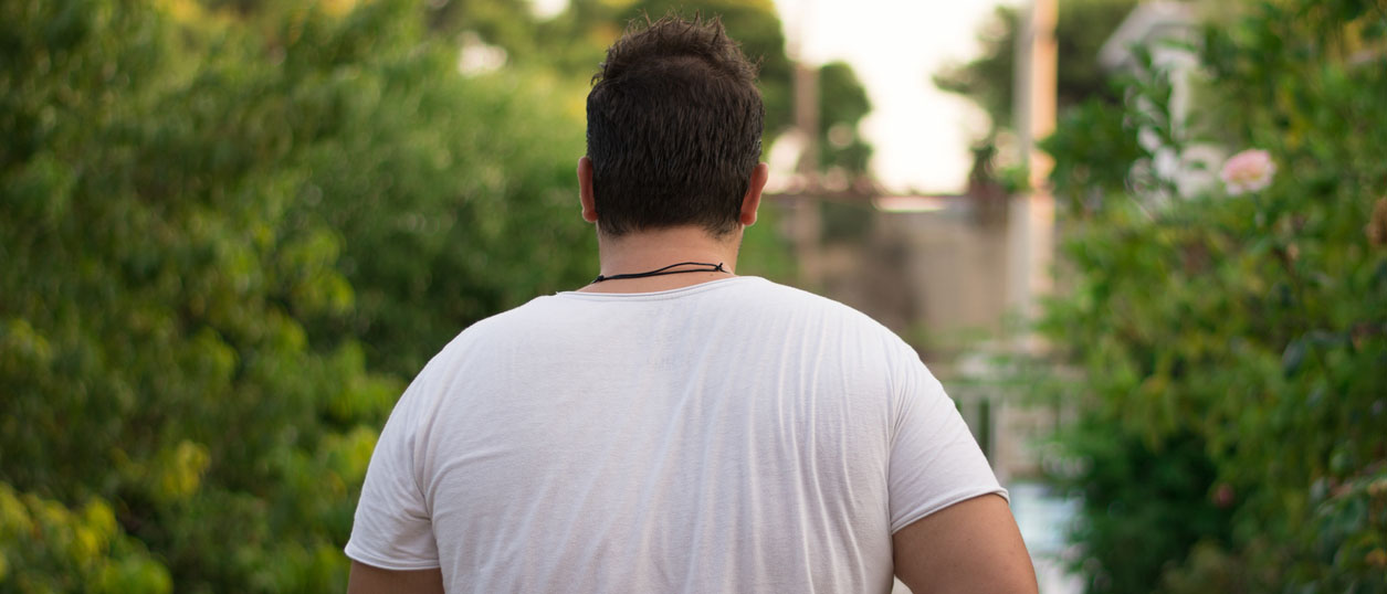 Rear view of an overweight person, 1400px