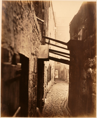 Image of plate 8 of Closes and Streets: Shows struts being used to support an unsafe building