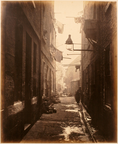 Image of plate 13 of Closes and Streets: people loitering in an alley where the gutter overflows with sewage
